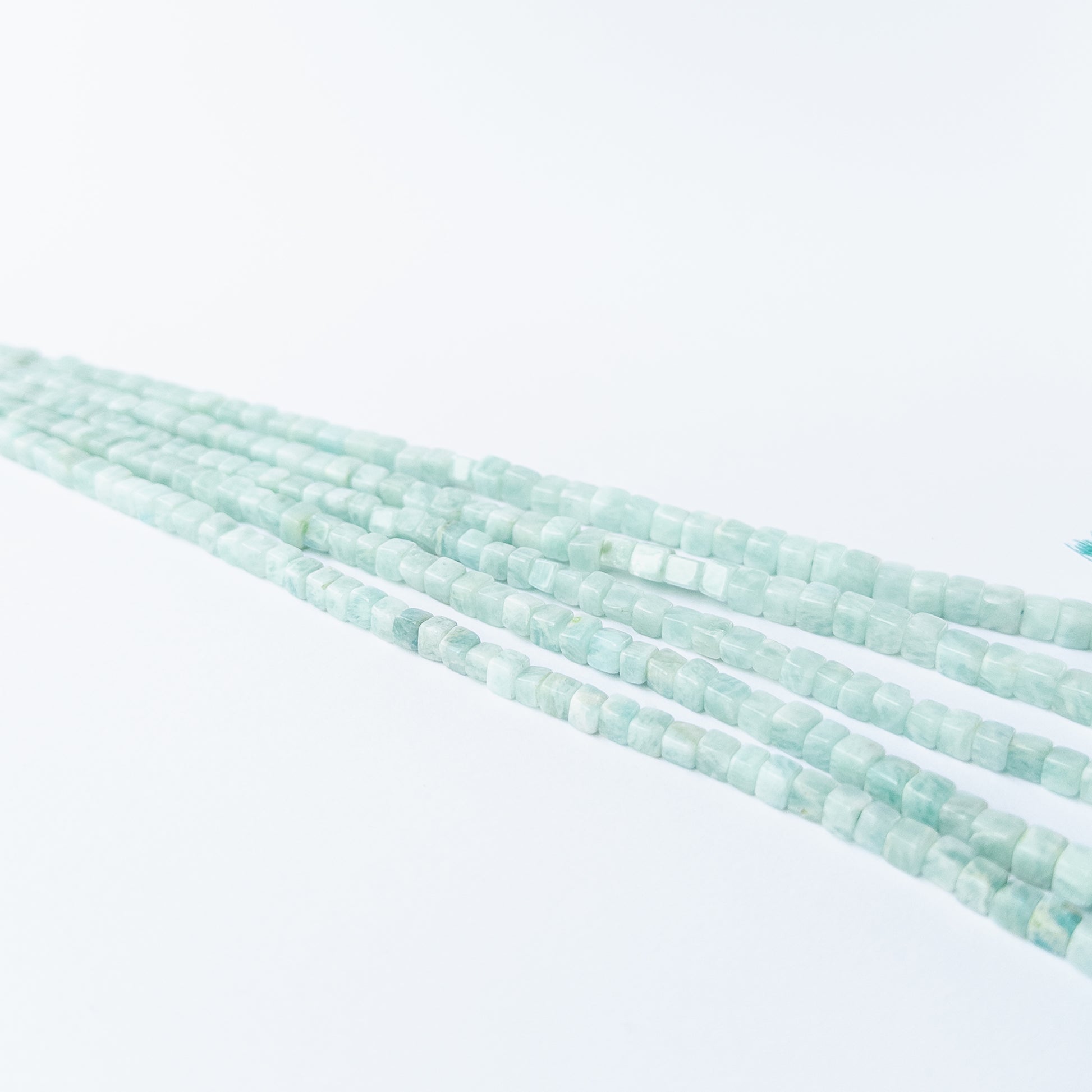 Authentic Amazonite cube stone beads with calming hues, ideal for DIY jewellery and gemstone beadwork.