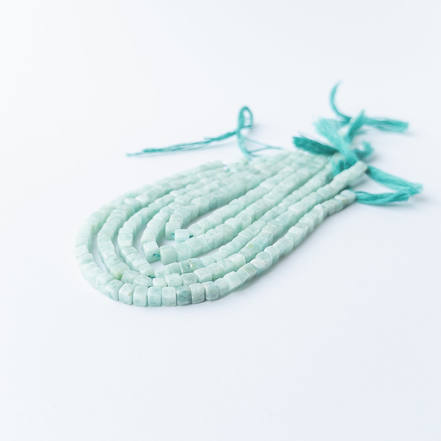 Genuine Amazonite gemstone beads with smooth cube cut, perfect for artisan jewellery designs.