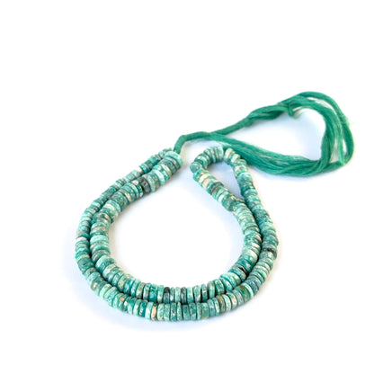 Amazonite smooth wheel beads showing soft aqua colour and polished texture for handmade jewellery components.
