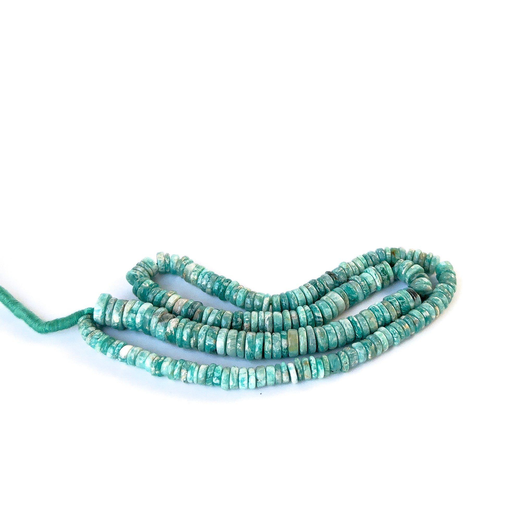 Amazonite stone beads in smooth wheel cut, showcasing soft colour variations and a polished surface.