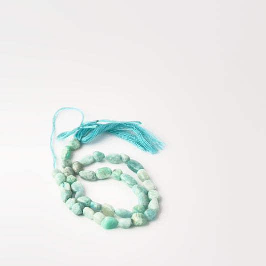 Genuine Amazonite tumble‑smooth beads, 5.5–6mm, arranged on a 33cm strand for handmade jewellery components.