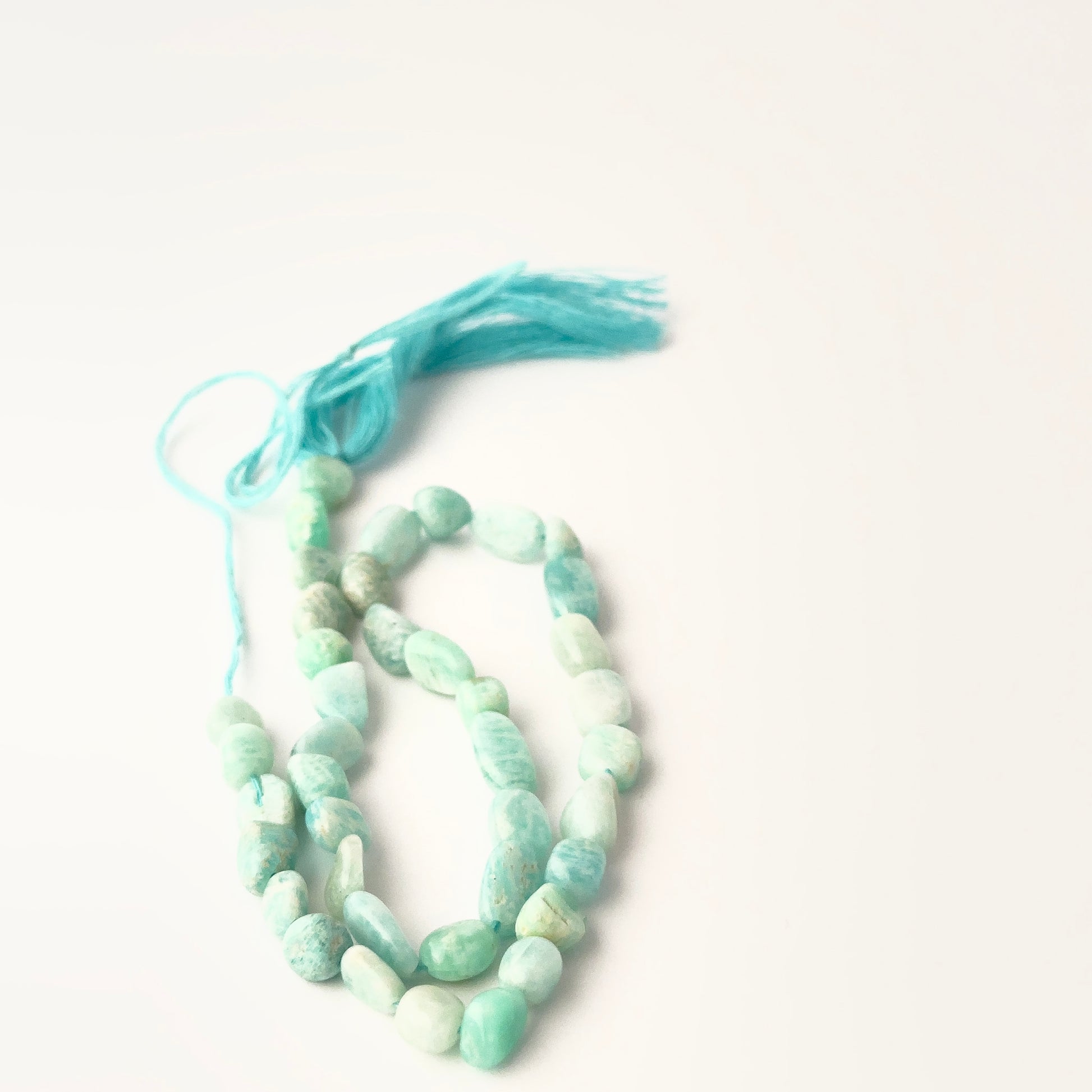 High‑quality Amazonite stone beads, 5.5–6mm smooth tumbles on a 33cm strand, ideal for jewellery designers.
