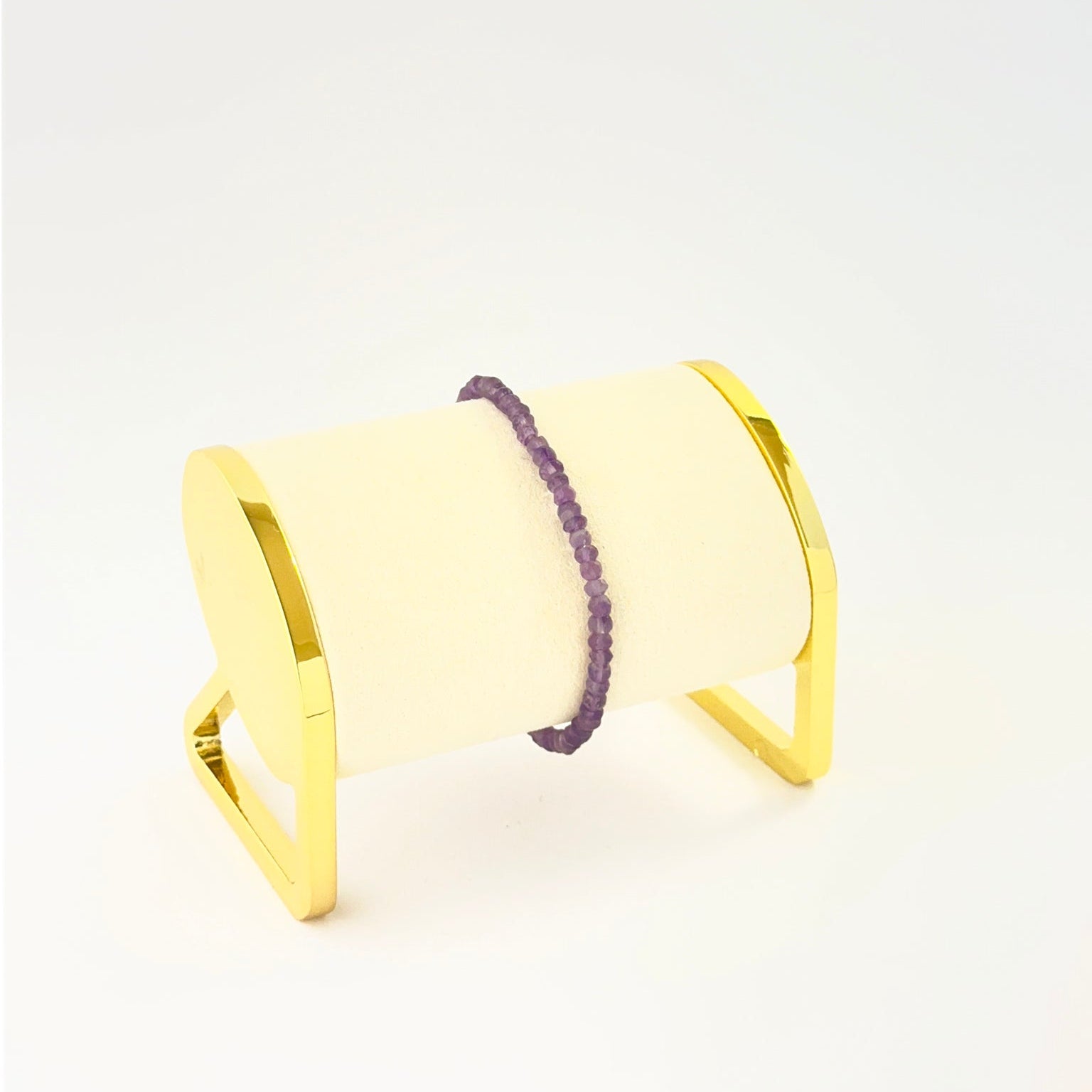 Elegant faceted rondelle amethyst bracelet crafted in a single adjustable strand.