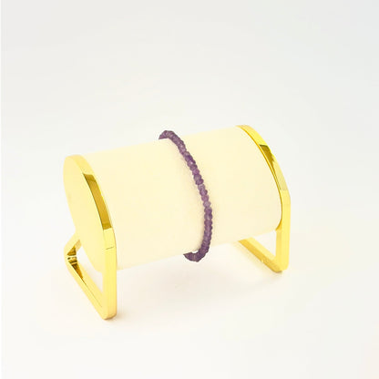 Elegant faceted rondelle amethyst bracelet crafted in a single adjustable strand.