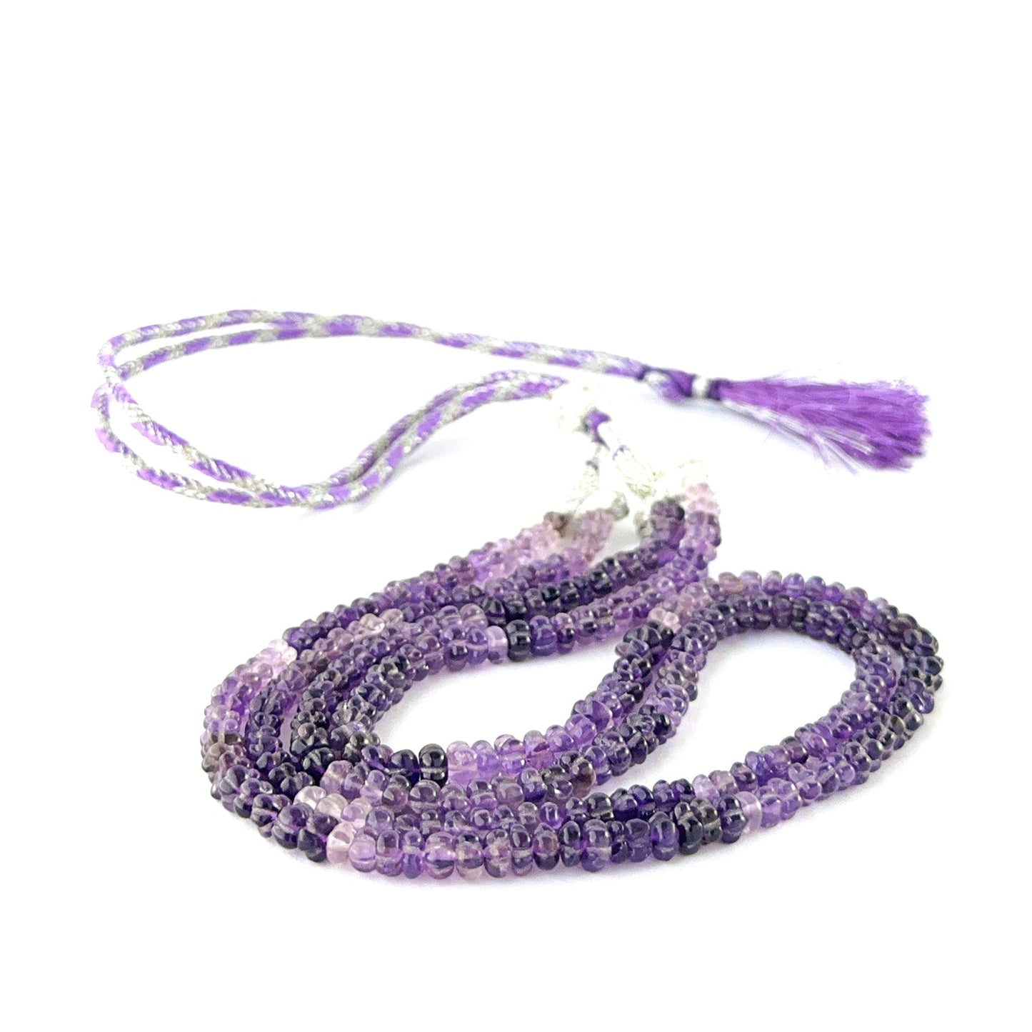 Elegant two‑strand amethyst necklace showcasing carved 6mm pumpkin beads.