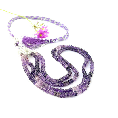 Carved pumpkin amethyst bead necklace arranged in two strands with adjustable length.
