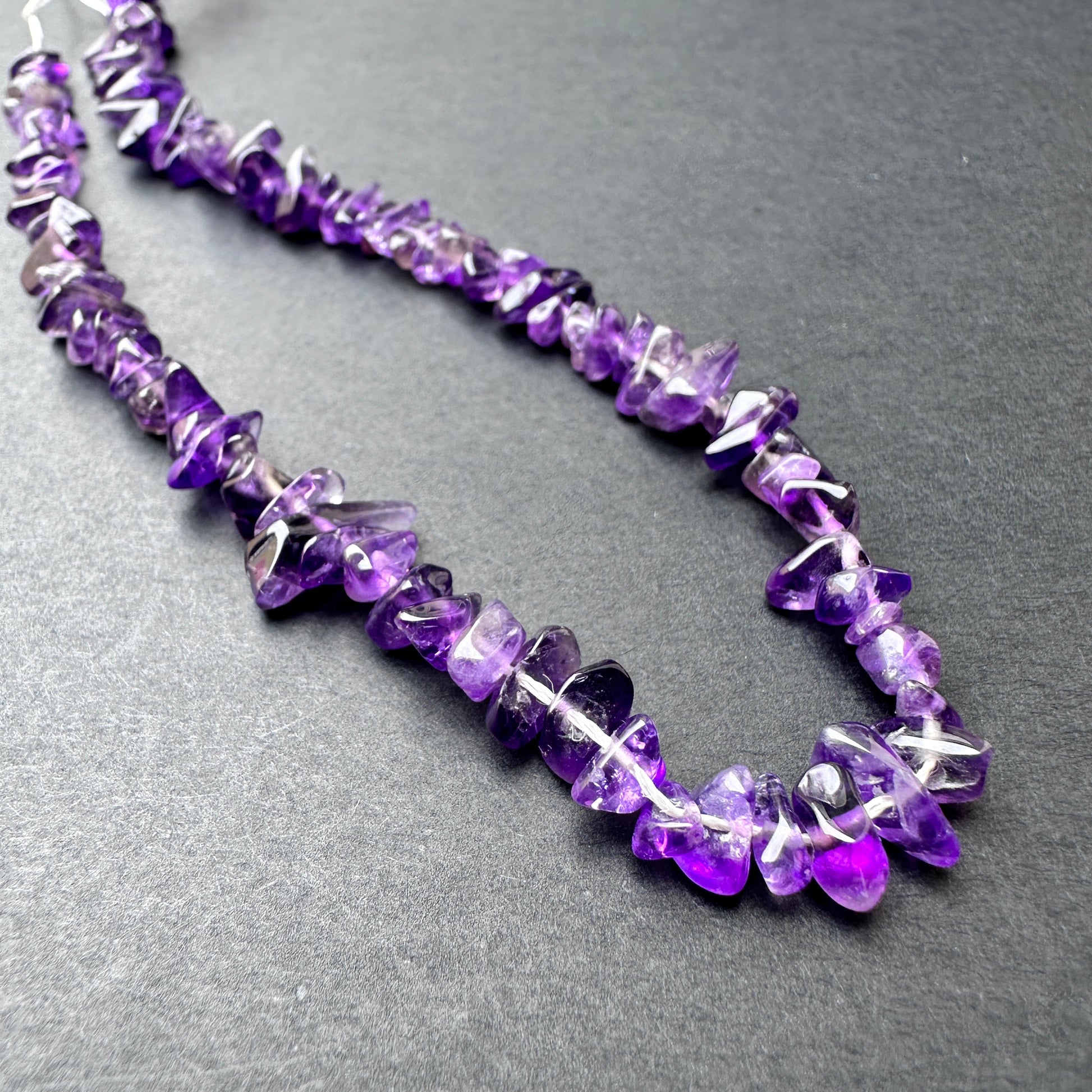 Stone Beads in Amethyst with polished smooth chip cut for handmade jewellery components.