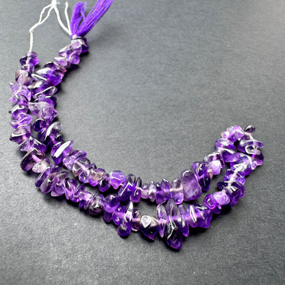 Handmade jewellery components featuring Amethyst beads with organic shapes and lustrous finish.