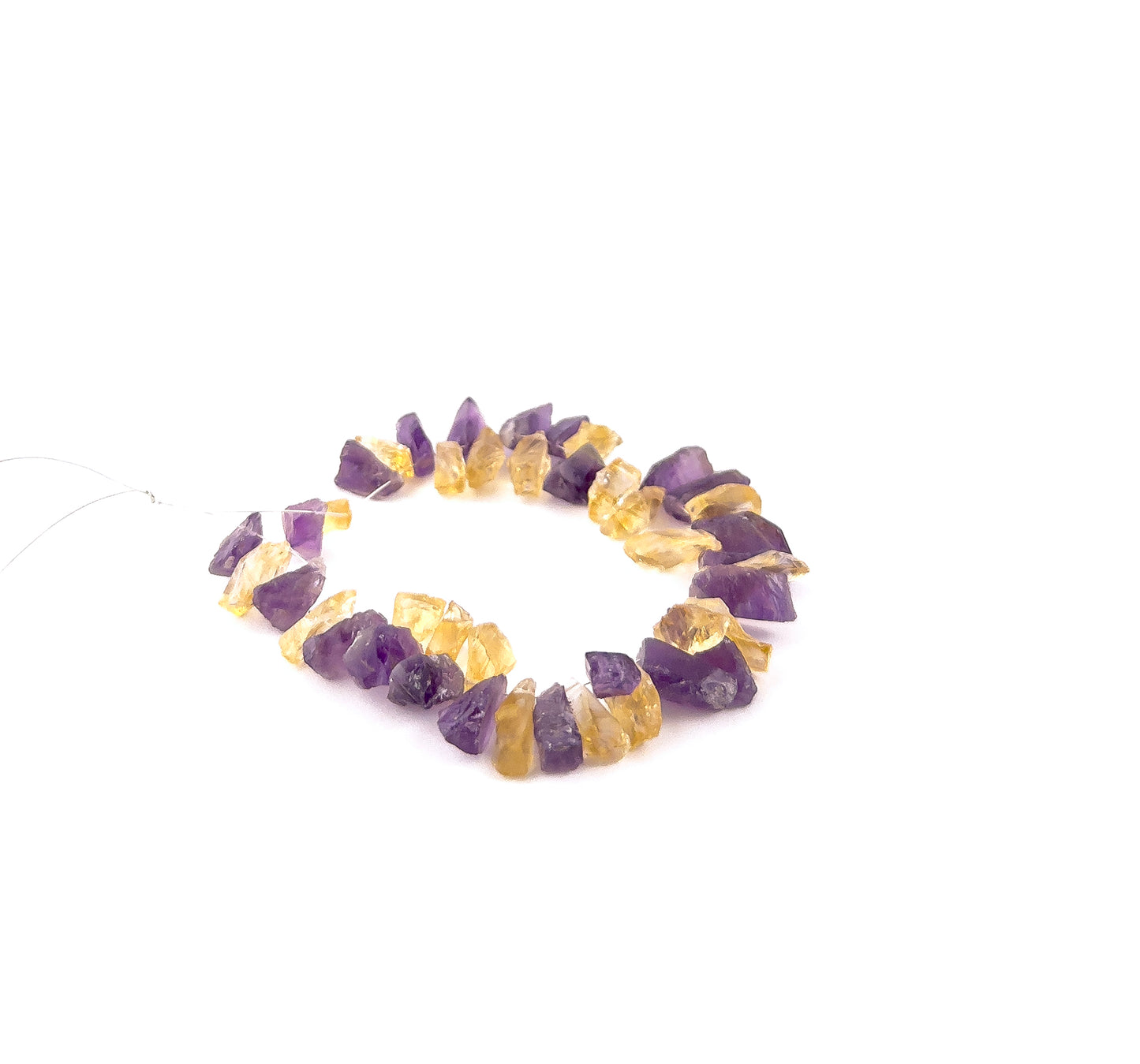Mixed Amethyst and Citrine rough gemstones in 6–8mm drilled form, showcasing vibrant purple and golden tones across 43 pieces.