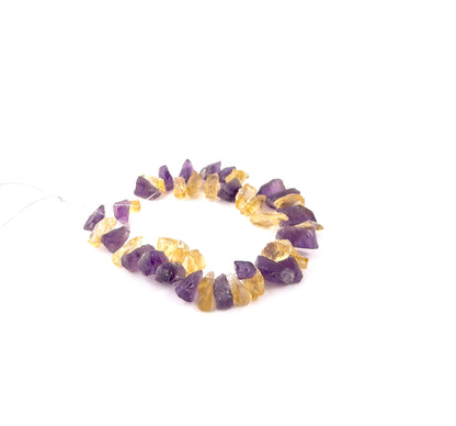 Mixed Amethyst and Citrine rough gemstones in 6–8mm drilled form, showcasing vibrant purple and golden tones across 43 pieces.