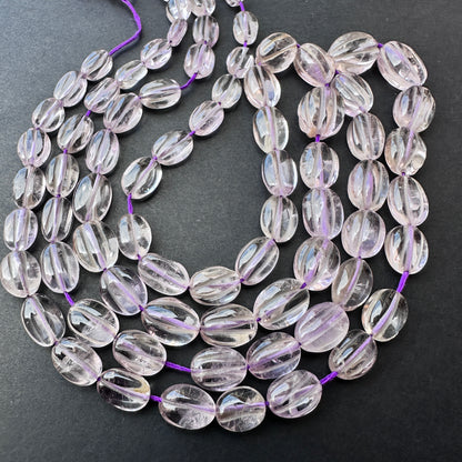 Natural amethyst gemstone beads in smooth oval cut, perfect for handmade jewellery and DIY designs. Strand length 40cm with 0.5mm bead holes.