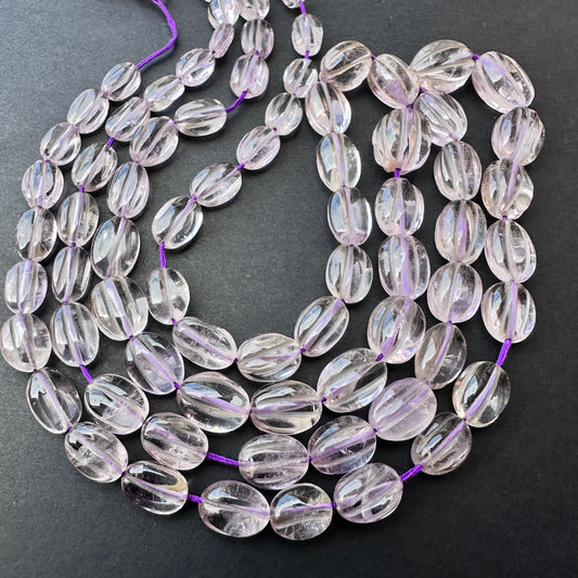 Natural amethyst gemstone beads in smooth oval cut, perfect for handmade jewellery and DIY designs. Strand length 40cm with 0.5mm bead holes.