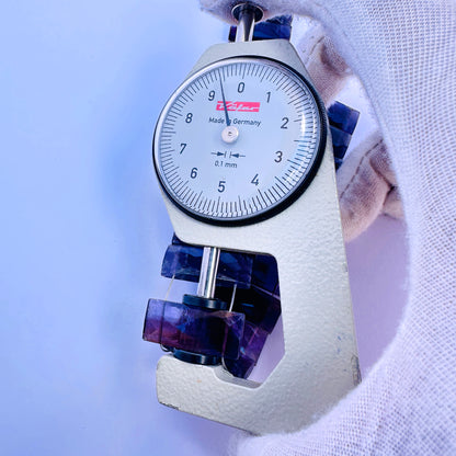 Amethyst gemstone beads for jewellery making displayed with soft lighting.