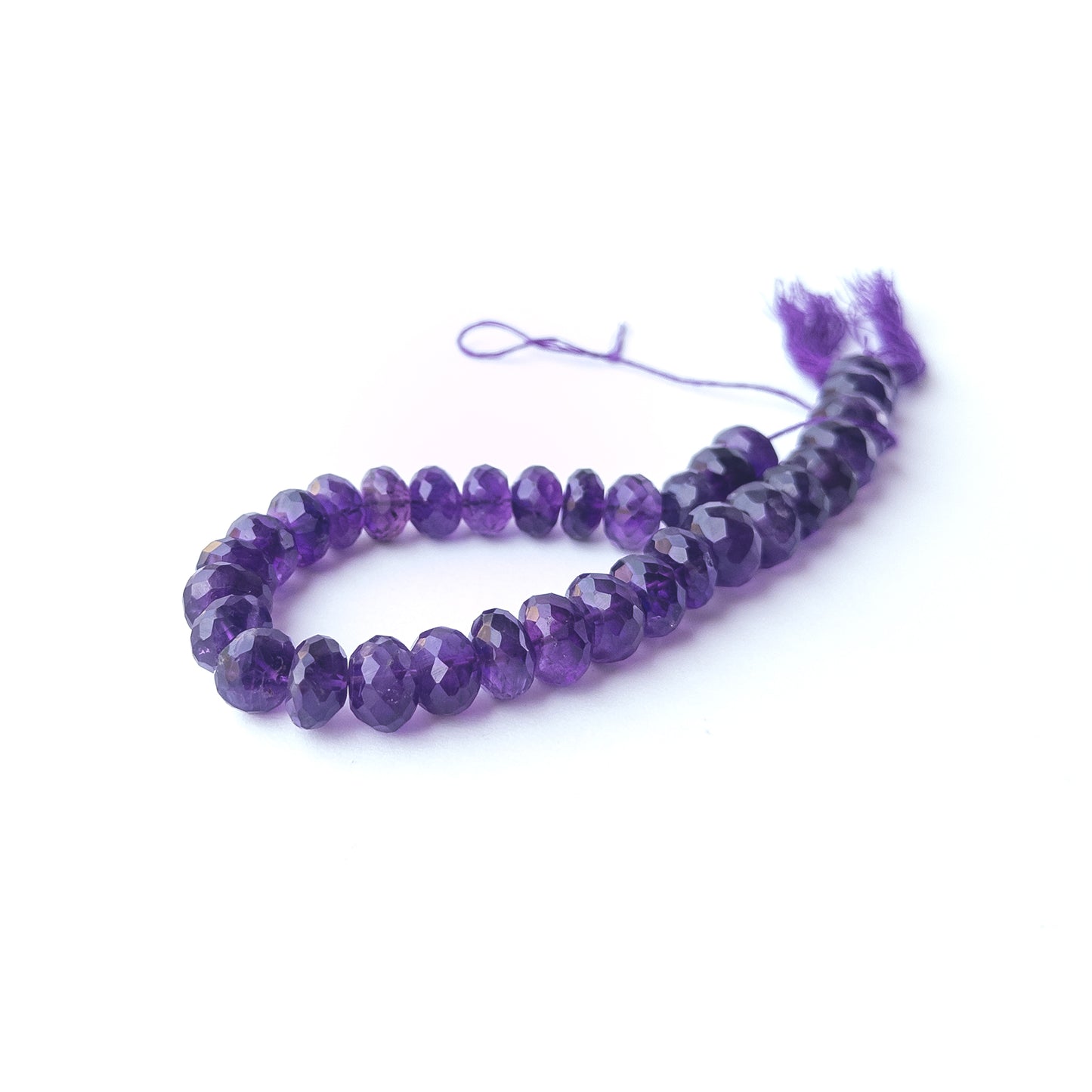 Premium Amethyst gemstone beads featuring faceted rondelle shine and uniform craftsmanship.