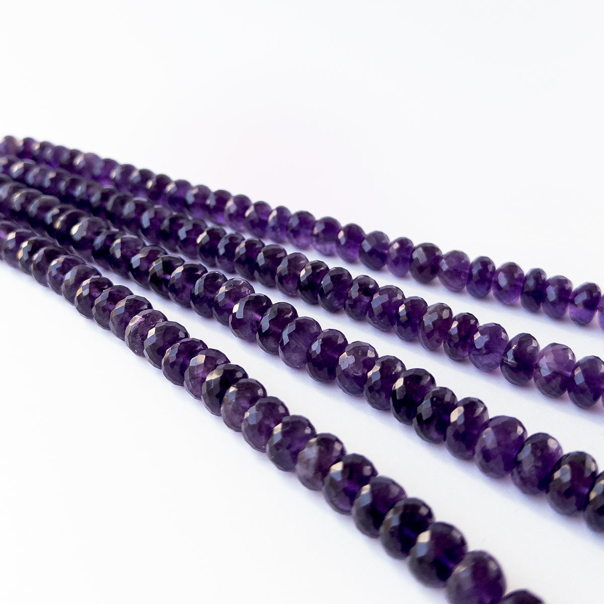 Large Amethyst faceted rondelle beads in 10.5–11.5mm sizes for artisan jewellery components.