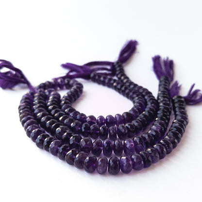 Authentic Amethyst gemstone beads displaying polished facets and premium purple clarity.