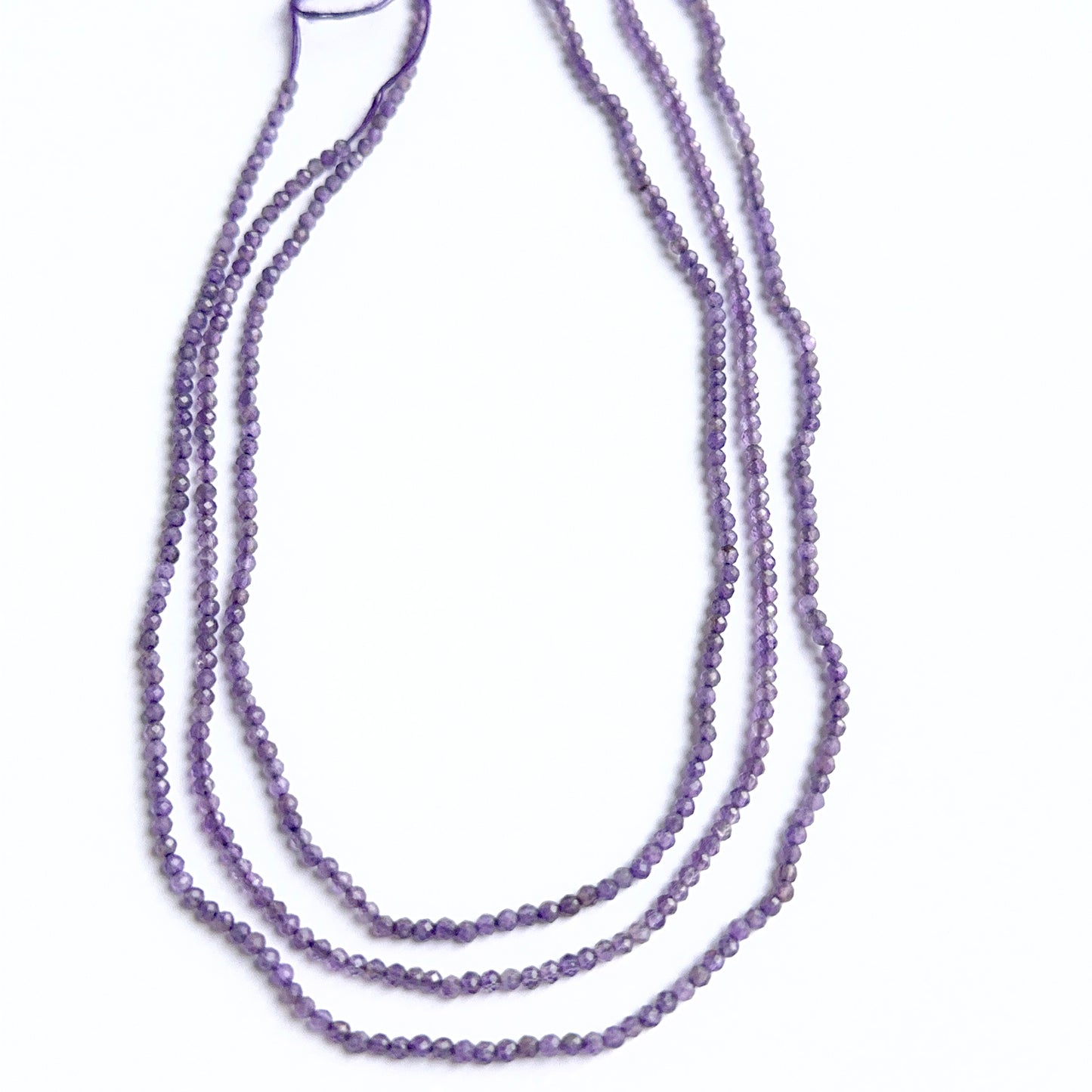 Amethyst faceted rondelles photographed to show brilliance, depth of colour and gemstone quality.