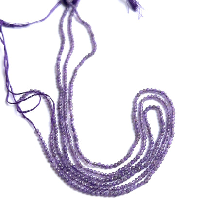 Faceted amethyst beads displayed with shimmering surfaces ideal for natural gemstone jewellery making.