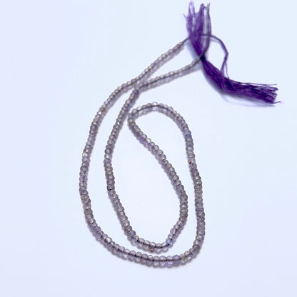 Fine Amethyst stone beads in 2.4mm faceted rondelle cut, displaying polished sparkle for jewellery designers.
