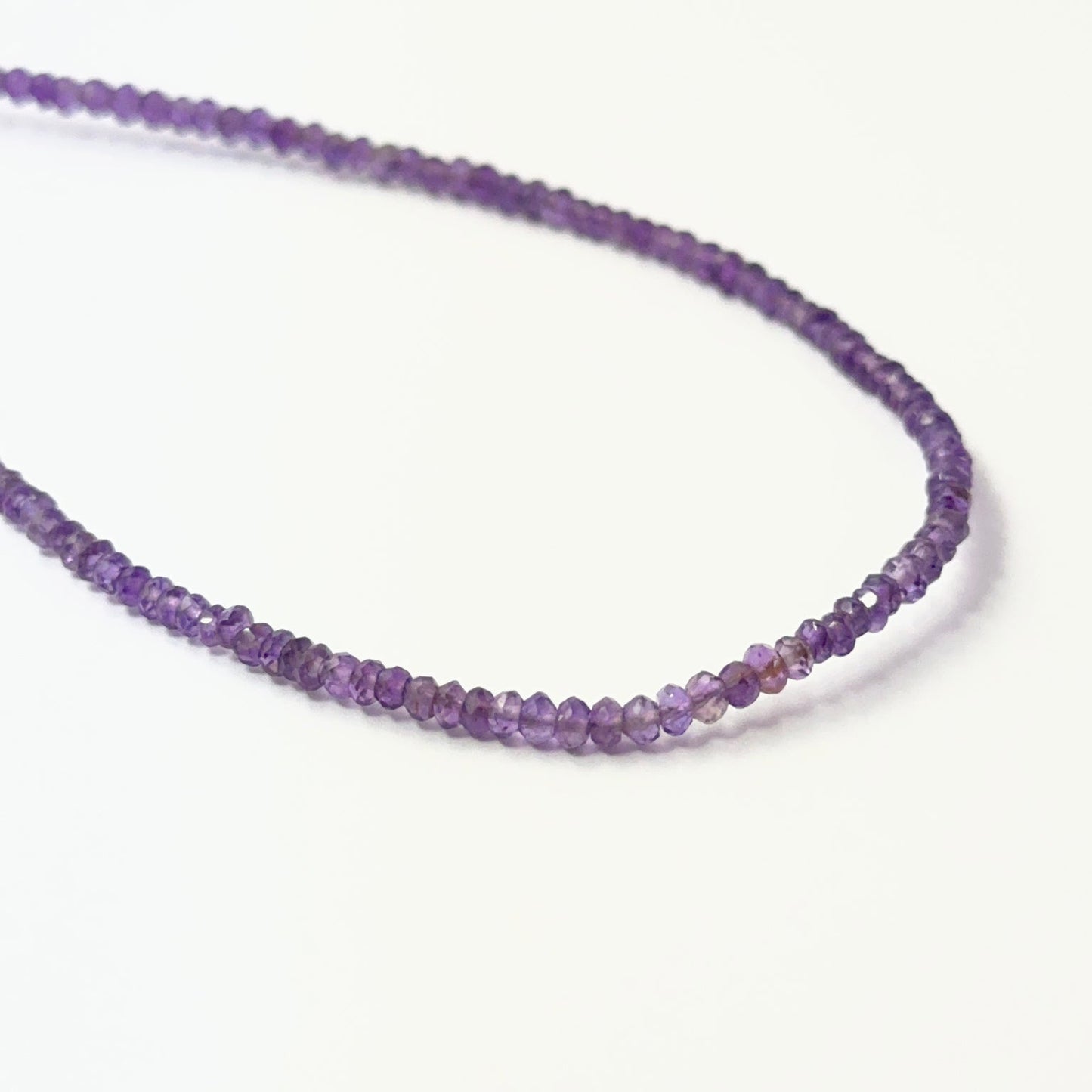 Amethyst faceted rondelle beads in vibrant purple tones, showcasing 2.7–3mm stone beads ideal for DIY jewellery.