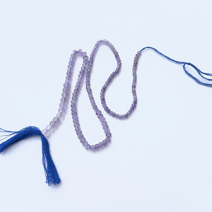 Amethyst faceted rondelle beads showing rich purple tones and bright sparkle for handmade jewellery.