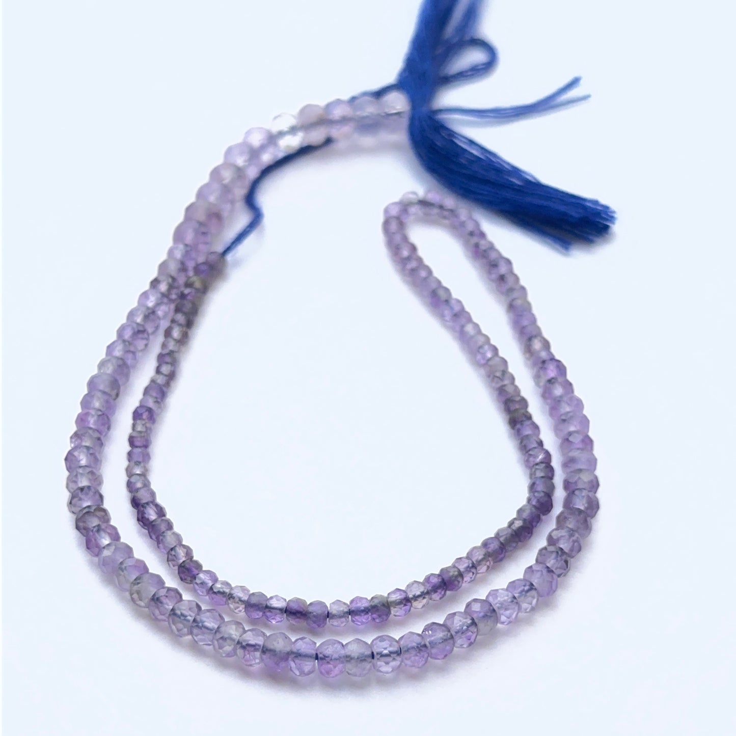 Amethyst faceted rondelles photographed to show brilliance, depth of colour and gemstone quality.
