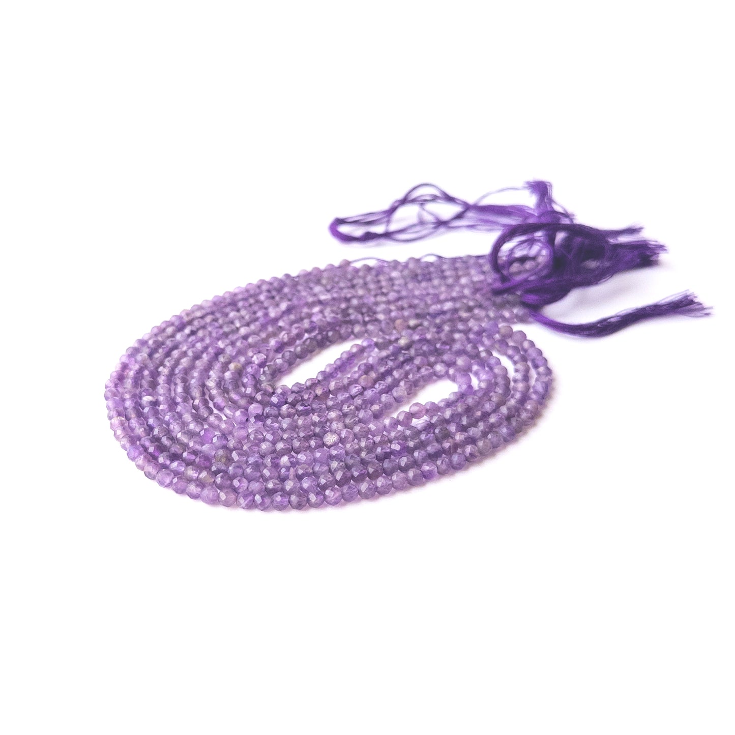 Amethyst faceted rondelle beads displayed in multiple strands, showing consistent 3.2mm sizing and natural variation.