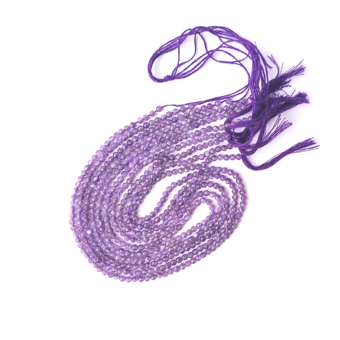 Genuine Amethyst gemstone beads in faceted rondelle cut, displaying polish, texture, and deep purple hues.