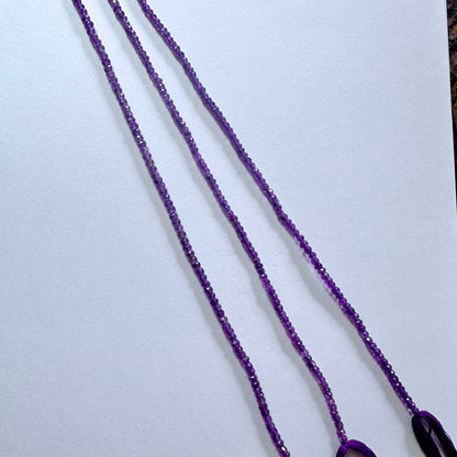 Faceted amethyst beads arranged in a 33cm strand with consistent sizing and elegant polish.