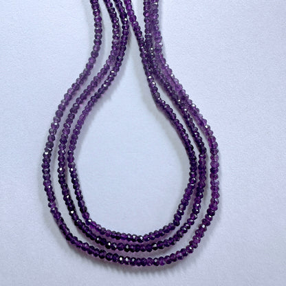 Amethyst faceted rondelle beads in 3.4-3.7mm size sparkle across a 33cm strand with rich purple tones.
