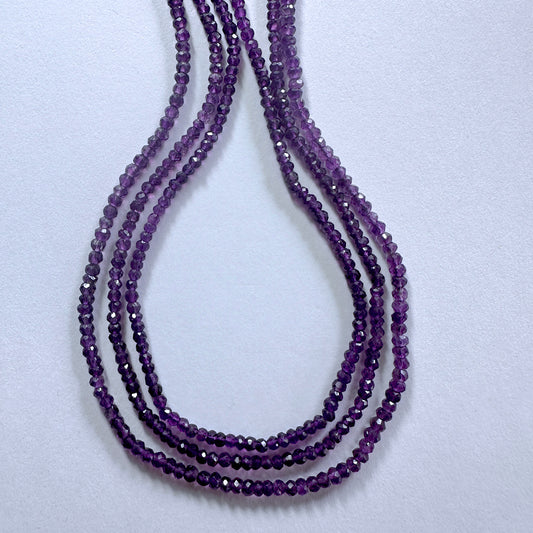 Amethyst faceted rondelle beads in 3.4-3.7mm size sparkle across a 33cm strand with rich purple tones.