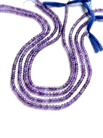 Natural amethyst gemstone beads in faceted rondelle cut, arranged neatly on a 33cm strand for DIY jewellery.