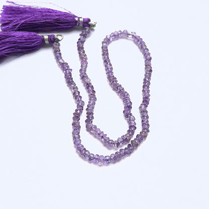Amethyst 3.8–4mm faceted rondelle beads arranged on a strand, showing crisp faceting and rich purple tones.