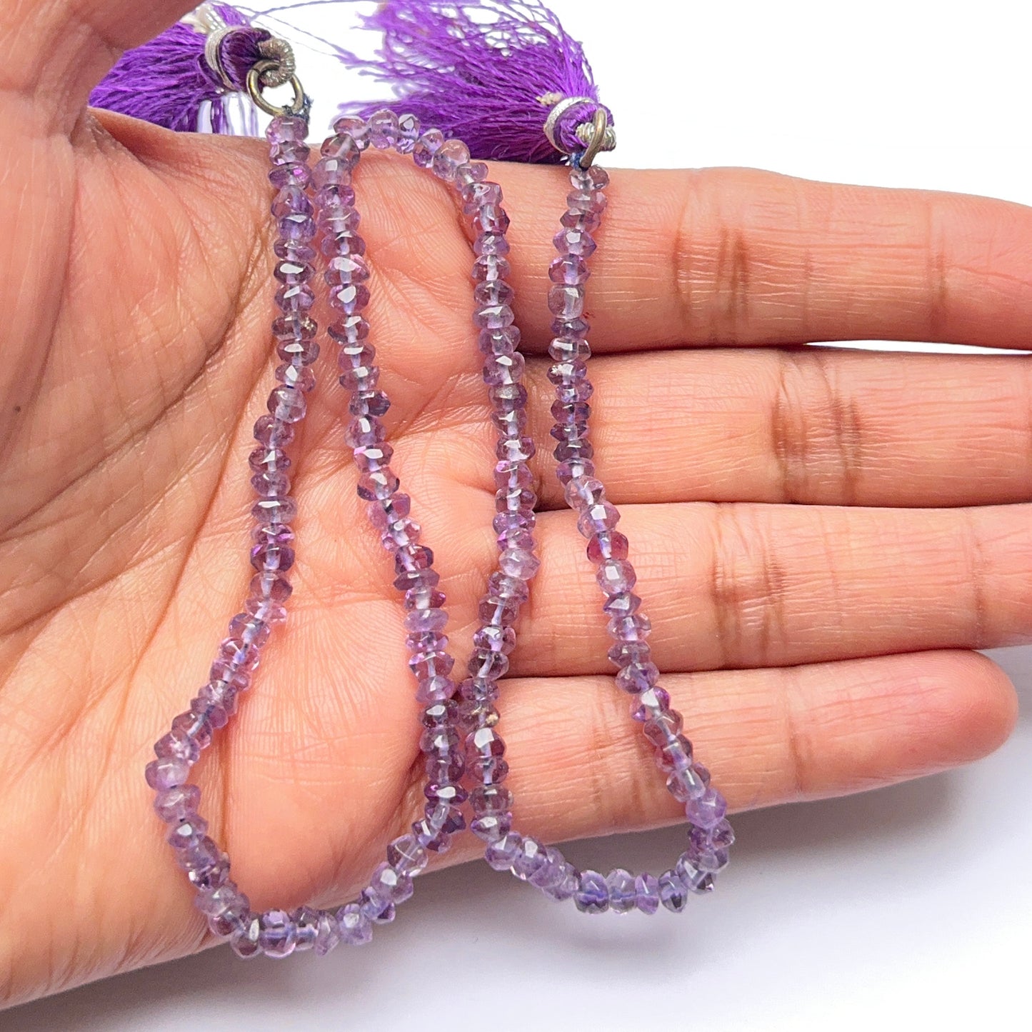 Amethyst natural gemstone beads in faceted rondelle shape, ideal for artisan jewellery and creative DIY beadwork.