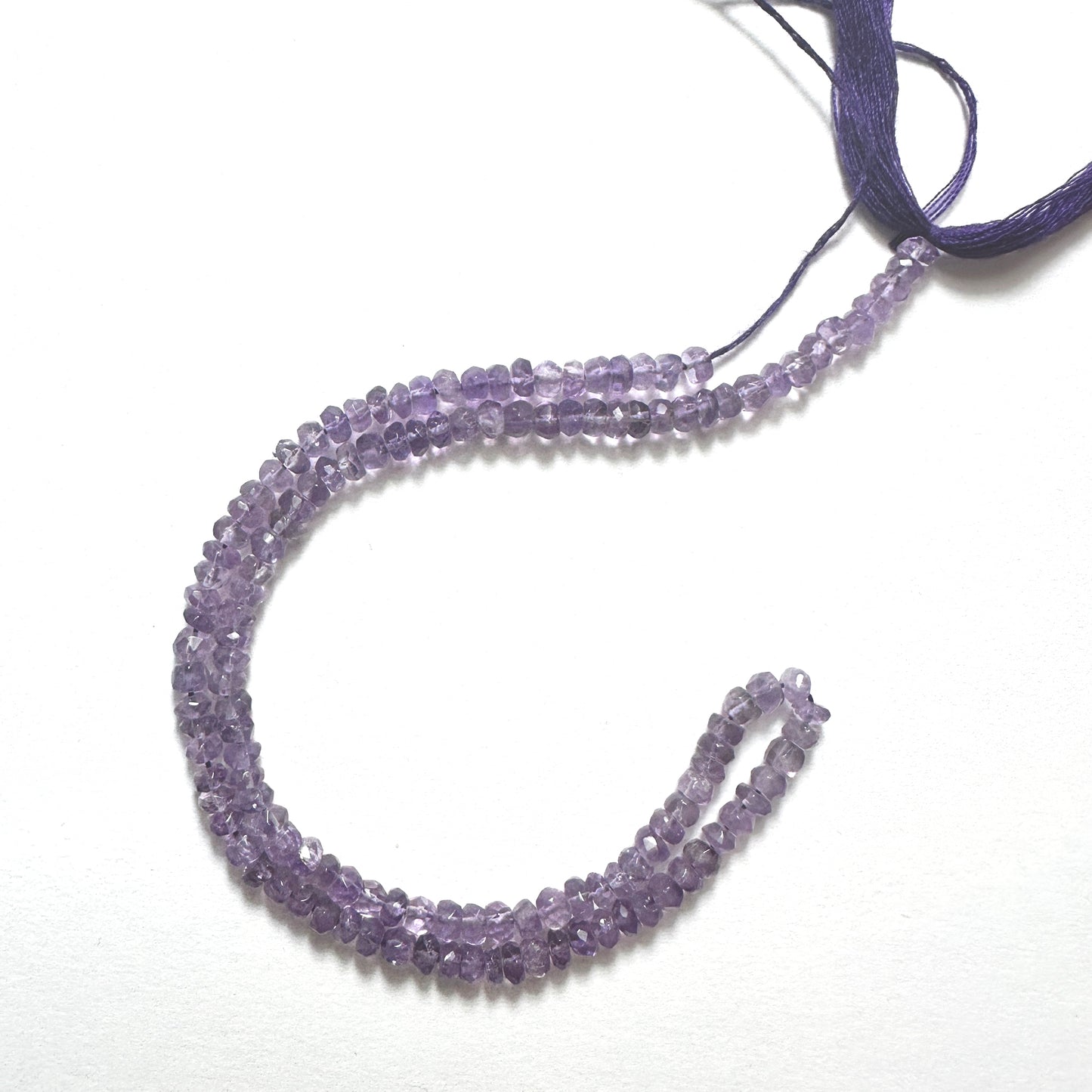 Natural gemstone beads for DIY jewellery featuring faceted Amethyst rondelles with vibrant colour and smooth polish.