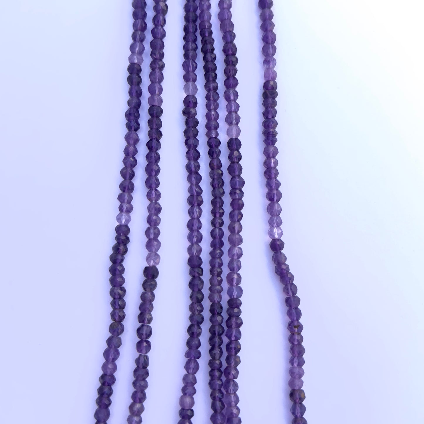 Amethyst gemstone beads for DIY jewellery displayed with soft lighting and clarity.