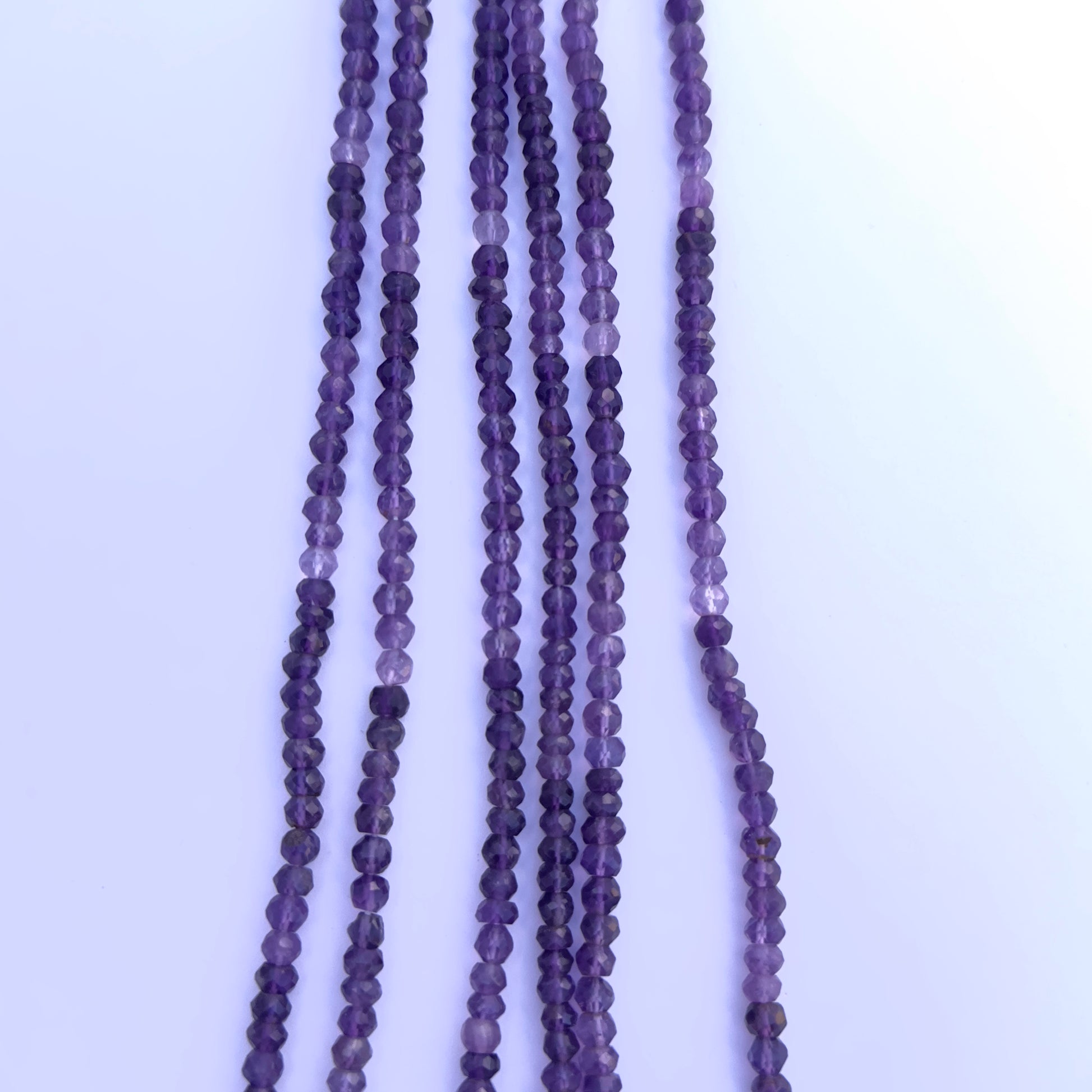 Amethyst gemstone beads for DIY jewellery displayed with soft lighting and clarity.