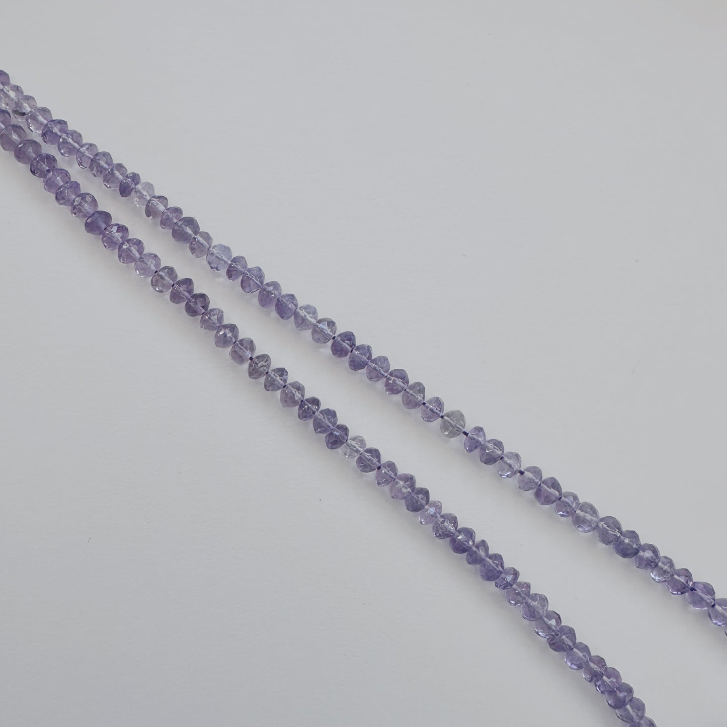 Amethyst stone beads with precise faceted rondelle cut and premium polish.