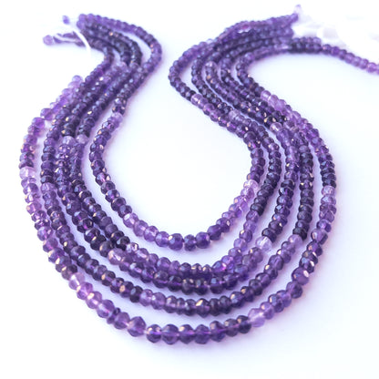 Close‑up of genuine Amethyst faceted rondelle beads highlighting their shine, clarity and precise 4.5–5mm cut.