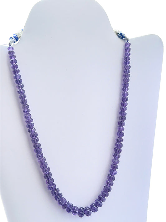 Purple amethyst necklace with carved beads showing rich colour and unique texture.