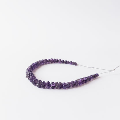 High‑quality Amethyst gemstone beads with carved ridges and natural brilliance for jewellery crafting.