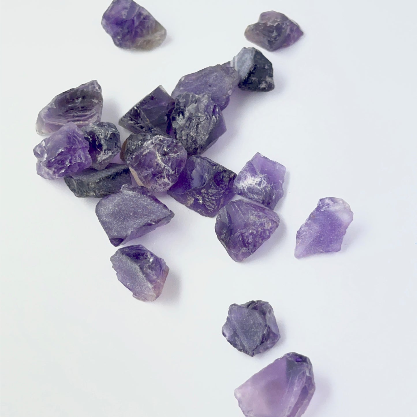 Amethyst rough undrilled stones showing deep purple tones and natural texture, ideal for genuine gemstone beads in DIY jewellery.