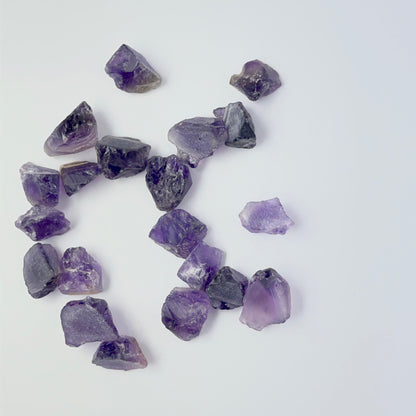 Close view of Amethyst rough pieces arranged together, highlighting rich colour and handmade jewellery component quality.