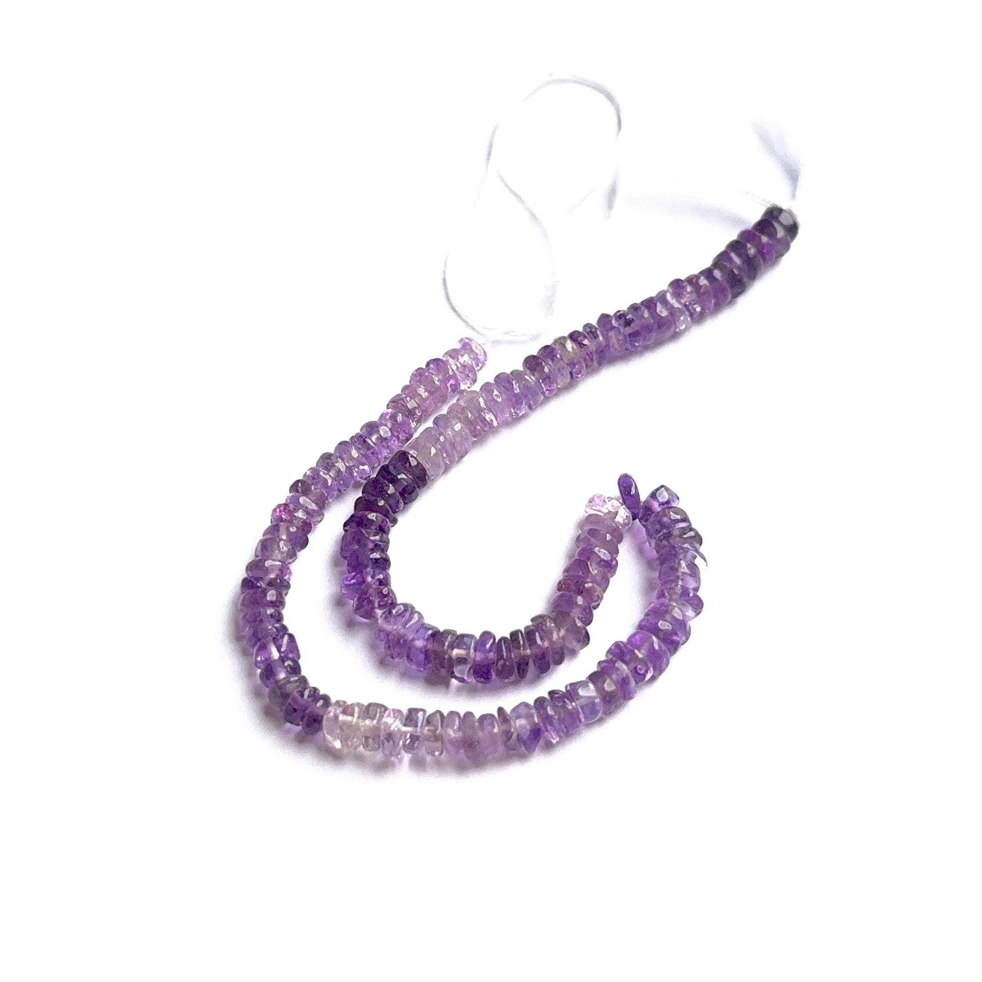 Amethyst smooth heishi beads showing rich purple tones and polished surfaces for handmade jewellery.
