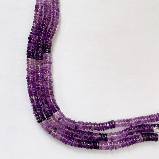 A vibrant strand of 6-7mm Amethyst Heishi beads showcasing their smooth finish and natural purple hues.