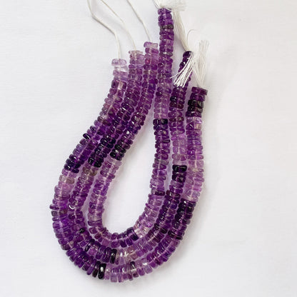 Detailed view of translucent purple Amethyst beads revealing consistent shape and top-grade clarity.