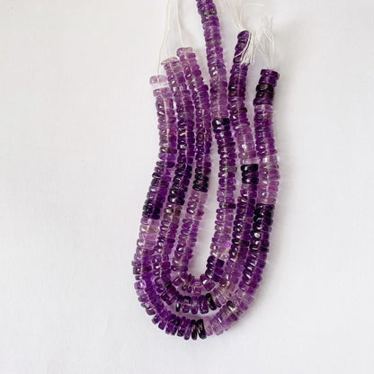 Natural daylight highlights the shine and lustrous texture of Amethyst Heishi cut gemstones.