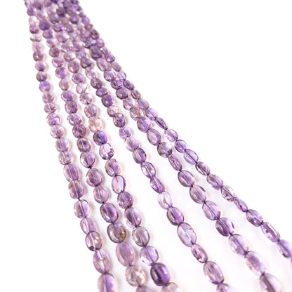 Premium Amethyst oval beads showcasing polished shine and rich purple colour for artisan jewellery designs.