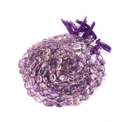 Elegant Amethyst oval beads with polished surfaces, ideal for handmade jewellery components and beadwork.