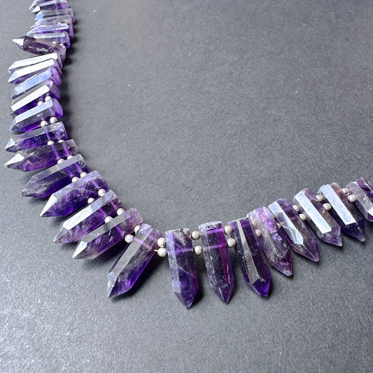 Natural gemstone beads in rich purple tones with elongated pencil cut for elegant jewellery making and gift creations.